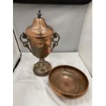 A VINTAGE COPPER AND BRASS URN WITH TAP AND A COPPER BOWL
