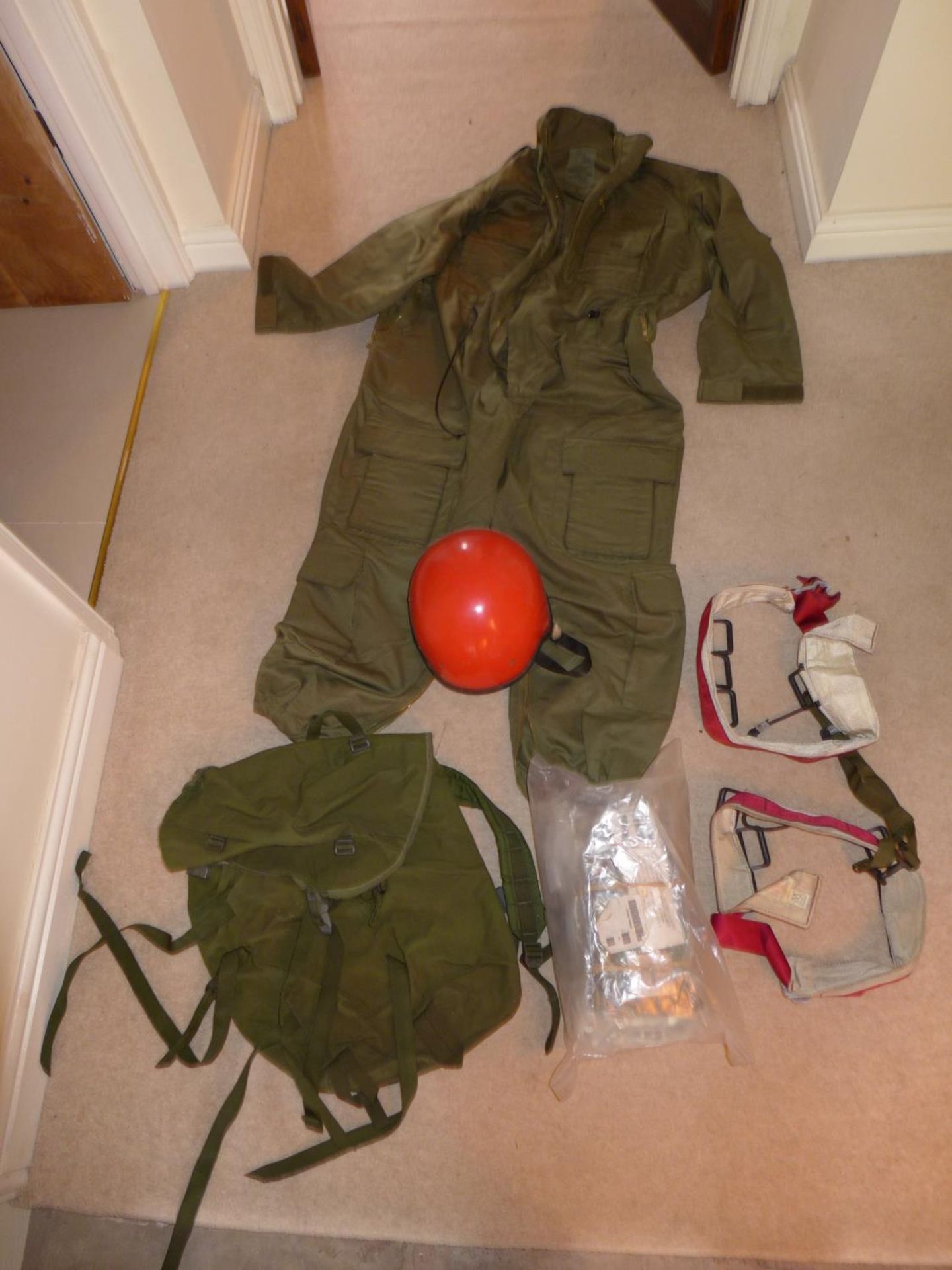 A MILITARY/OUTDOOR ADVENTURE COVERALL, RED HELMET, OVERBOOTS AND STRAPS ETC