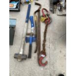 AN ASSORTMENT OF TOOLS TO INCLUDE A TOW CHAIN, CROW BARS AND A SLEDGE HAMMER ETC