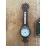 A VINTAGE WOODEN CASED ANEROID BAROMETER