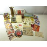 A COLLECTION OF ASORTED MILITARIA, 1918 SHELL CASE, SILK CIGARETTE CARDS, TINS ETC