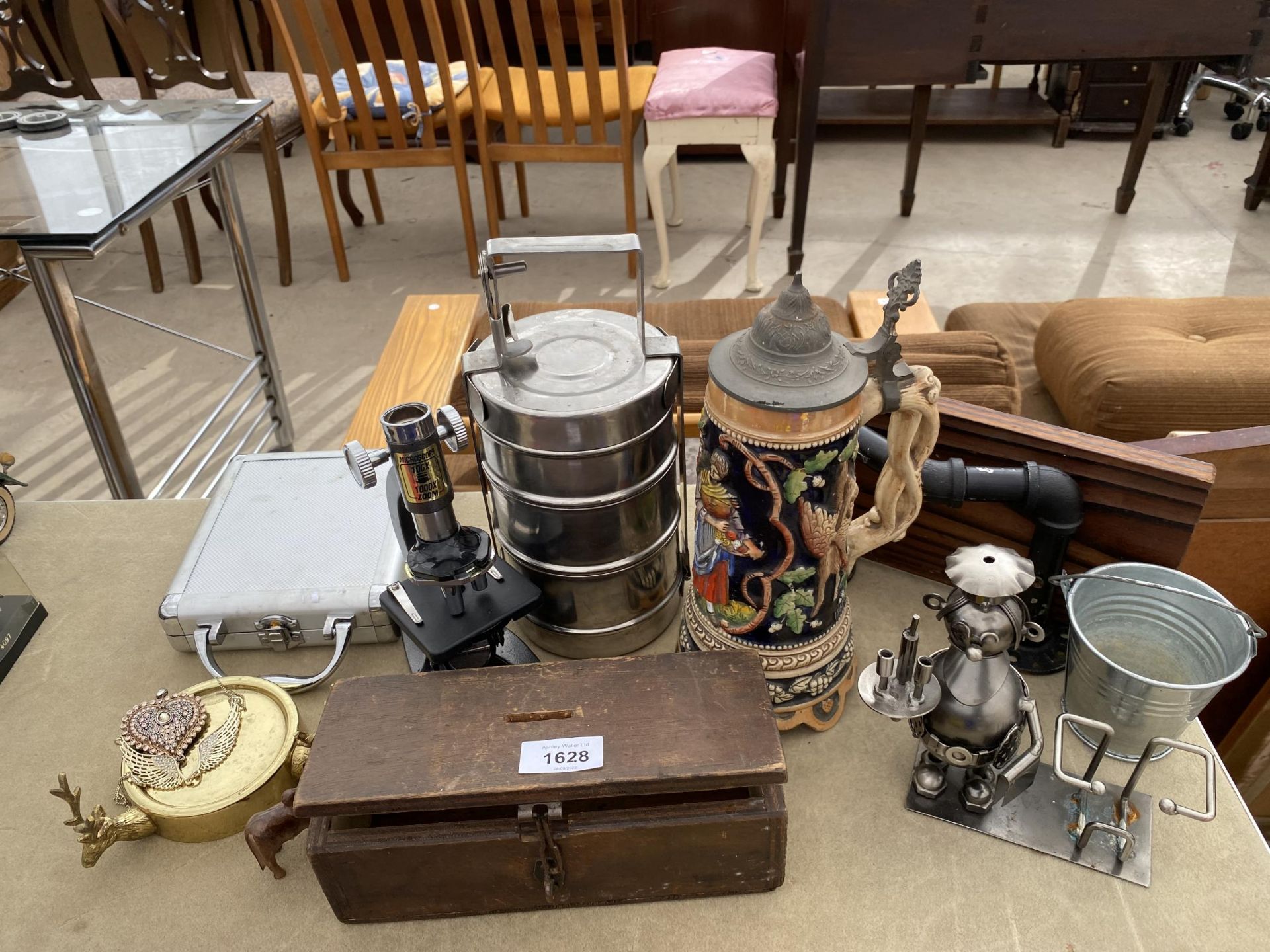 AN ASSORTMENT OF ITEMS TO INCLUDE A MUSICAL STEIN, A TREEN MONEY BOX, AND A MICROSCOPE ETC