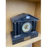 A HEAVY MARBLE MANTLE CLOCK WITH PLAQUE 'PRESENTED TO ELLIS LLYOD APRIL 1904'
