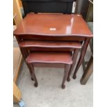 A MODERN MAHOGANY NEST OF THREE TABLES