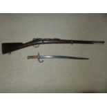 A FRENCH OBSOLETE CALIBRE CHASSEPOT RIFLE DATED 1876 AND BAYONET, 64CM BARREL, LACKING NEEDLE