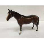 A BESWICK BROWN STANDING HORSE FIGURE