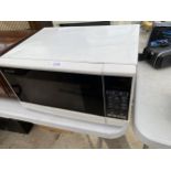 A WHITE SHARP MICROWAVE OVEN