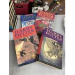 A COLLECTION OF FOUR PAPERBACK HARRY POTTER BOOKS BY J.K. ROWLING