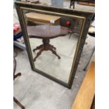 A MODERN GILT FRAMED WALL MIRROR, 40" X 28"