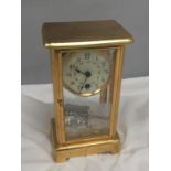 AN EARLY 20TH CENTURY CARRIAGE CLOCK WITH FLORAL ENAMELLING TO THE FACE IN A BEVELLED GLASS CASE