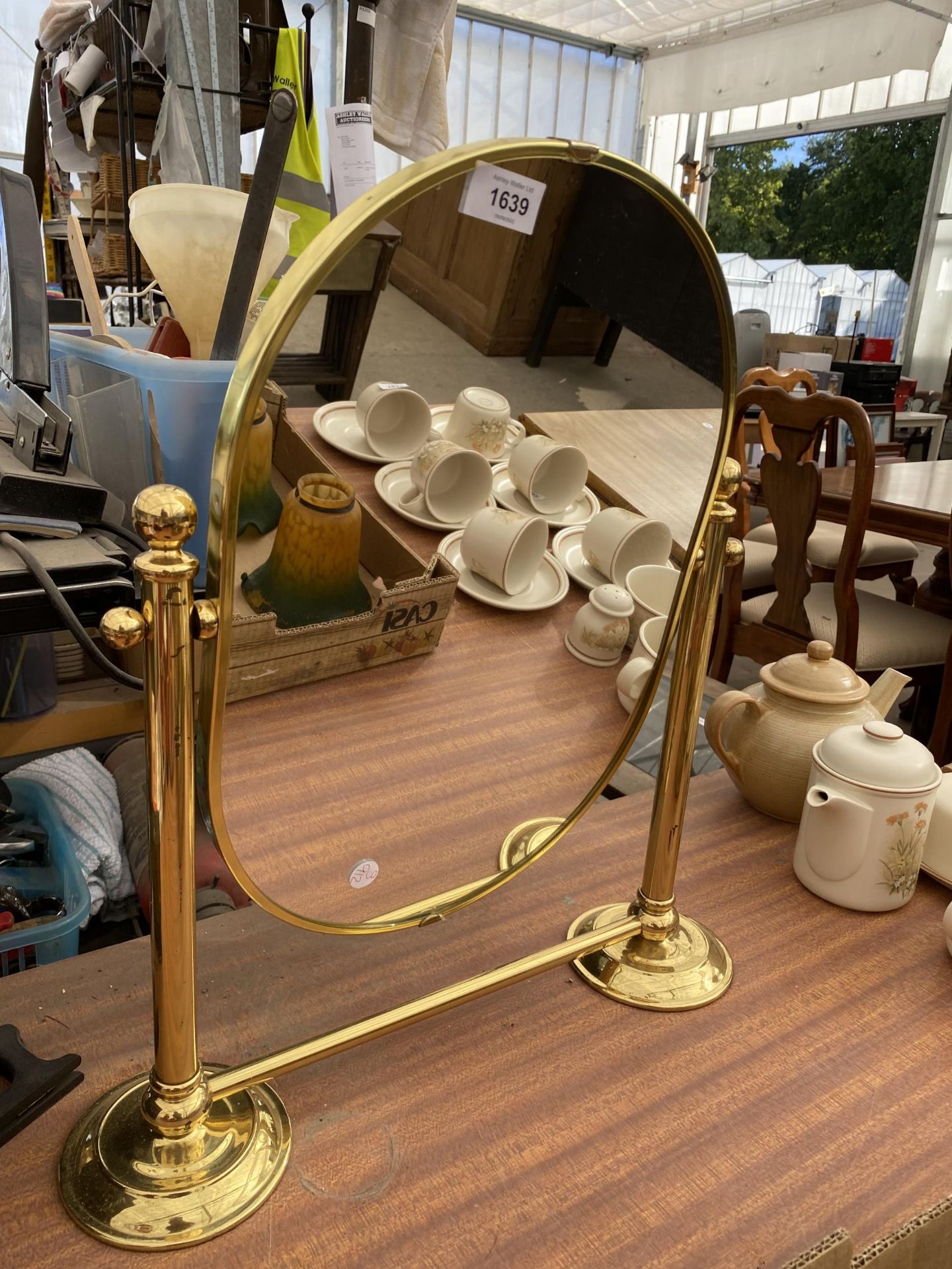 A BRASS SWING FRAME DRESSING TABLE MIRROR