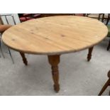 A MODERN 59" DIAMETER DINING TABLE ON TURNED LEGS
