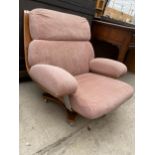 A RETRO G-PLAN HOUSEMASTER UPHOLSTERED SWIVEL LOUNGE CHAIR