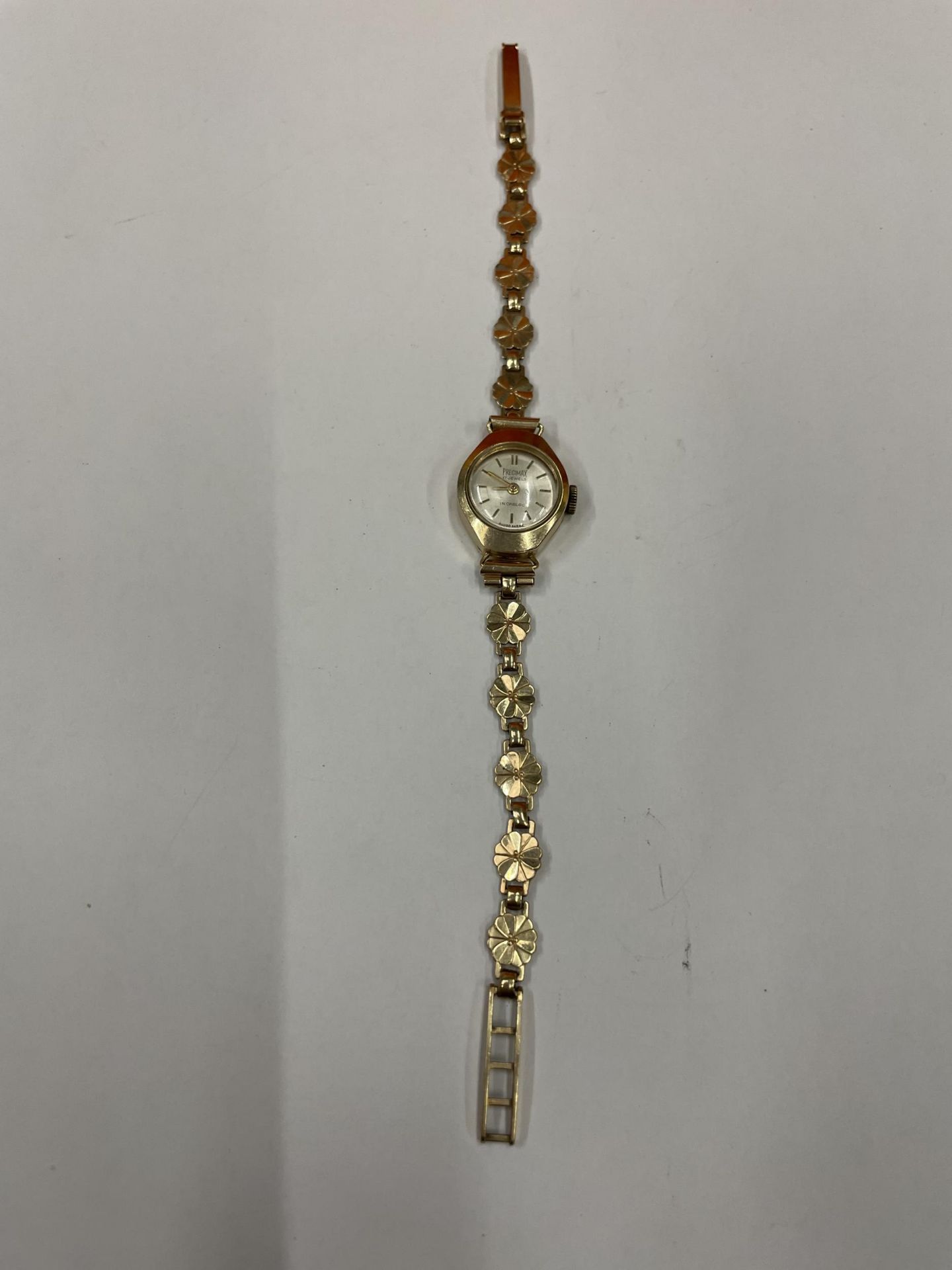 A PRECIMAX 17 JEWEL INCABLOC LADIES 9 CARAT GOLD WATCH AND STRAP APPROXIMATE WEIGHT 8.5 GRAMS