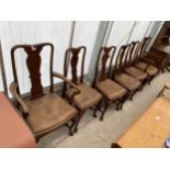 A SET OF SIX EDWARDIAN DINING CHAIRS IN THE QUEEN ANNE STYLE ON CABRIOLE LEGS TWO BEING CARVERS