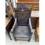 AN 18TH CENETURY OAK WAINSCOT CHAIR WITH CARVED BACK PANEL AND SEAT WITH MYTHICAL DRAGON LIKE ARM