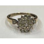 A 9 CARAT GOLD DIAMOND CLUSTER RING SIZE N
