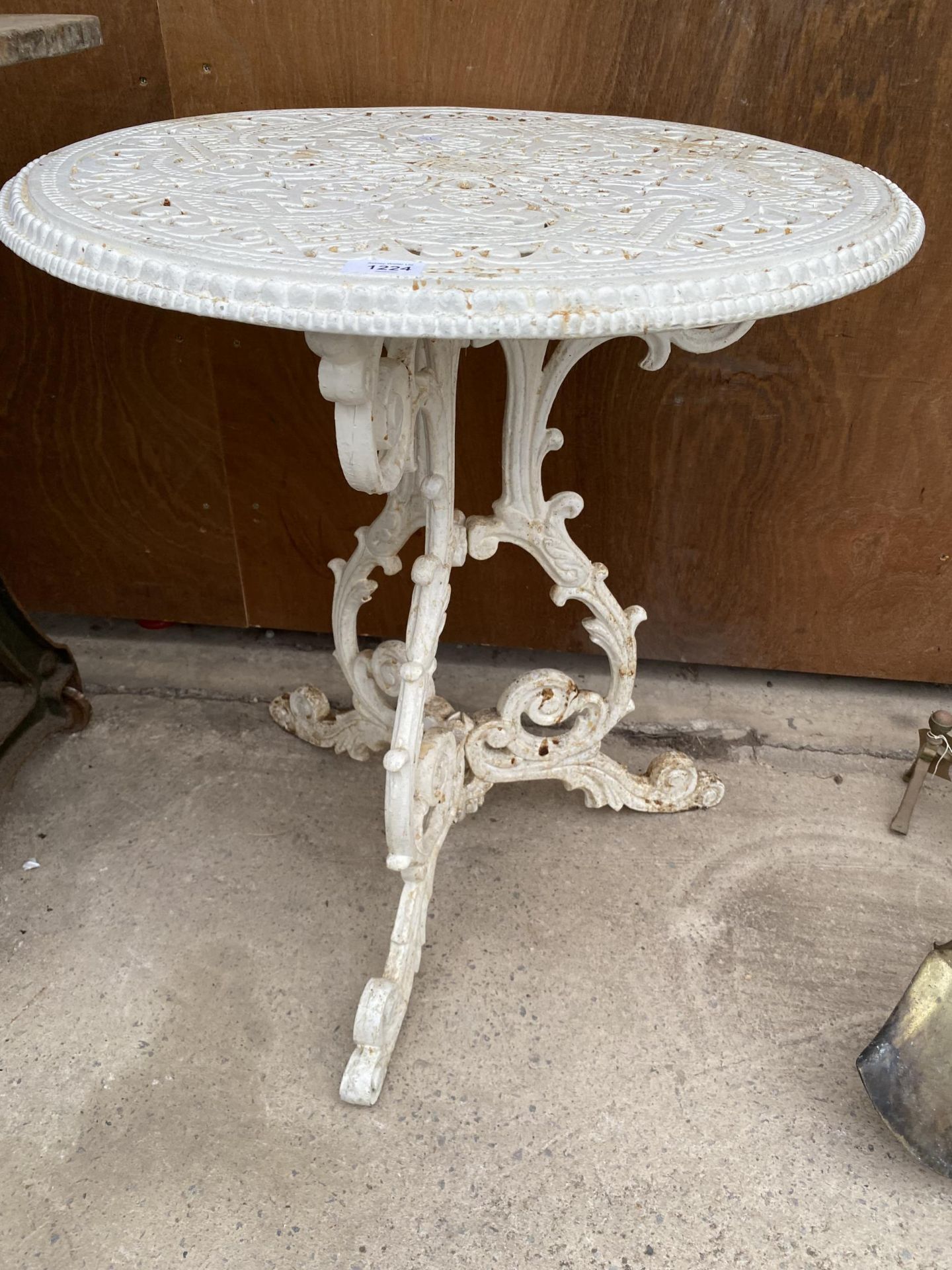 A WHITE CAST ALLOY BISTRO TABLE