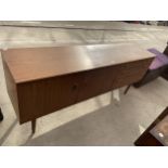 A RETRO TEAK SCHREIBER SIDEBOARD ENCLOSING THREE DRAWERS AND TWO CUPBOARDS, 70" WIDE