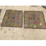 A PAIR OF GLAZED AND LEADED STAIN GLASS WINDOW PANES