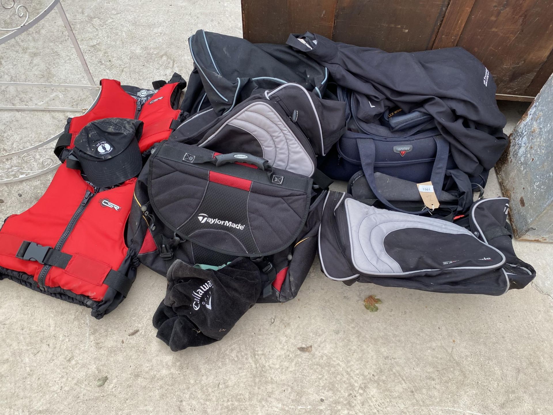 AN ASSORTMENT OF ITEMS TO INCLUDE HOLDALLS AND LIFE JACKETS ETC