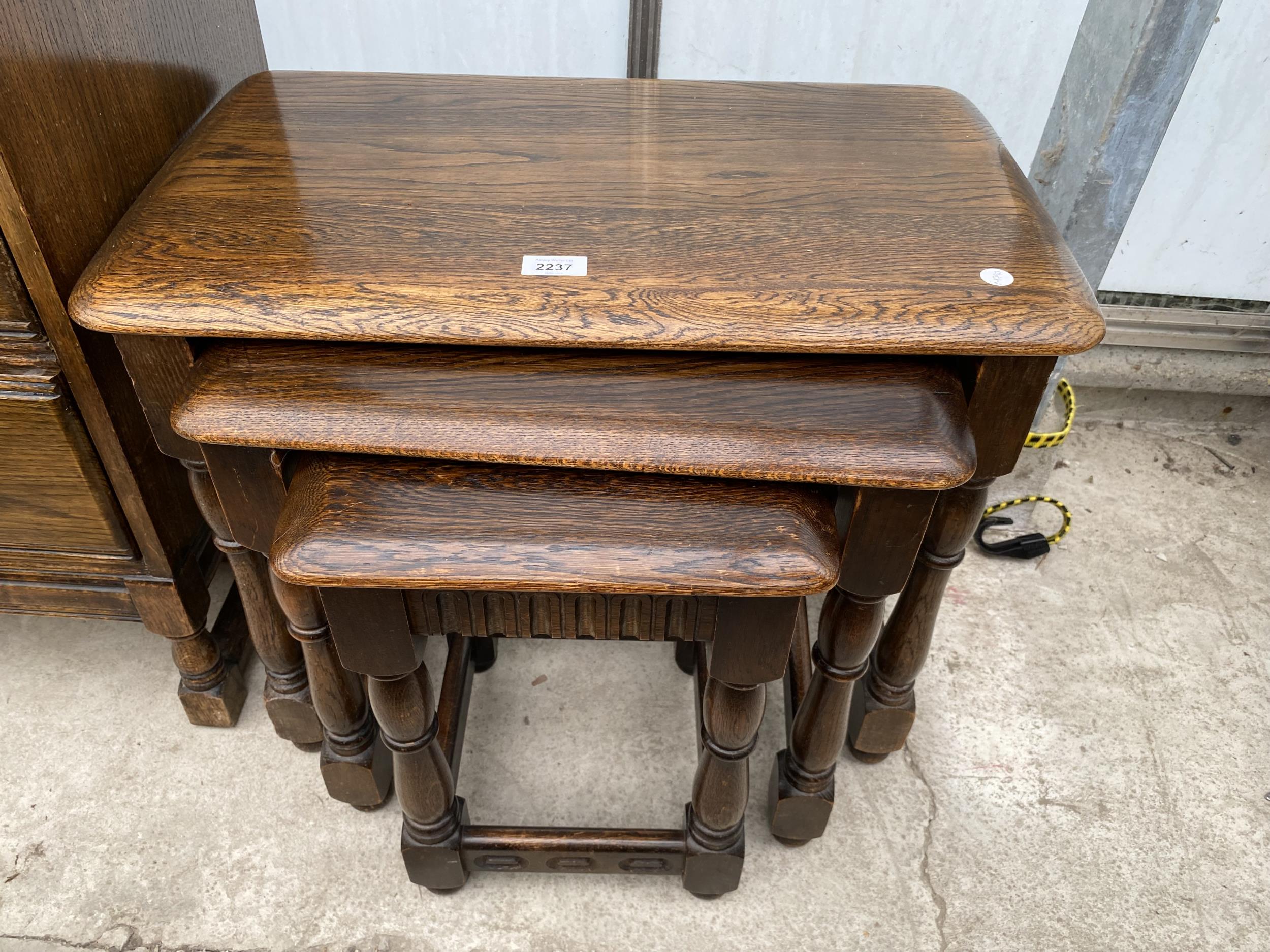 A MID 20TH CENTURY NEST OF THREE TABLES