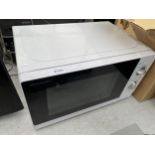 A WHITE SHARP MICROWAVE OVEN