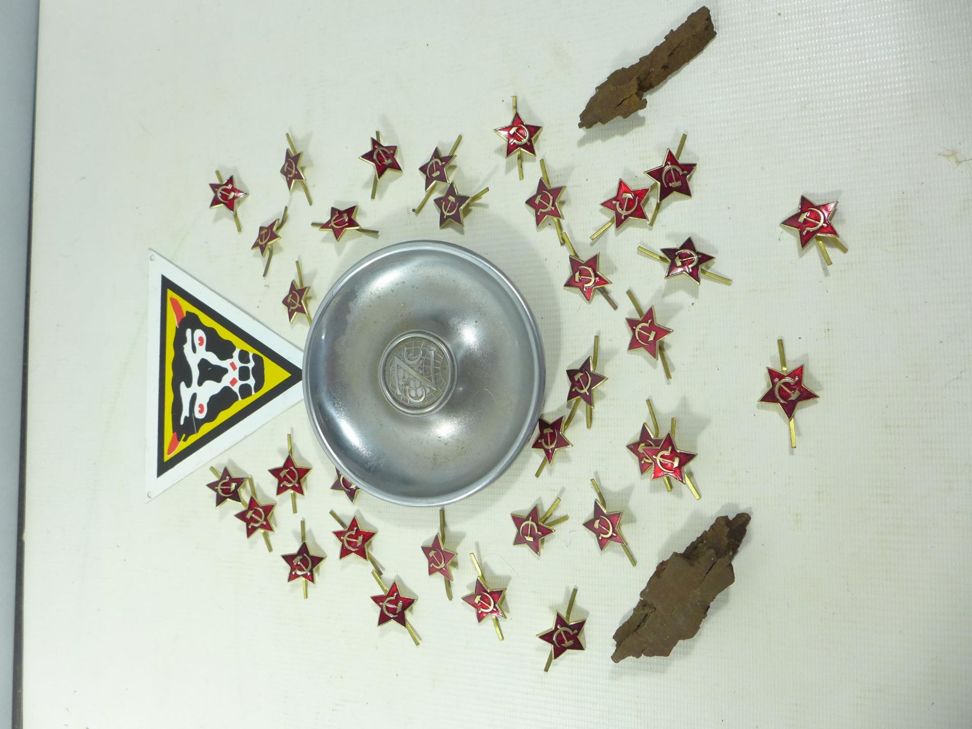A LARGE COLLECTION OF ENAMEL HAMMER AND SYCLE BADGES, TWO BITS OF SHRAPNEL, CAST MAZAK ZINK ALLOY