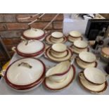 A QUANTITY OF ROYAL ALBERT DINNER WARE WITH A RED BORDER, GOLD FILIGREE ON A CREAM BACKGROUND TO