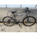 A TREK 4900 MOUNTAIN BIKE WITH FRONT SUSPENSION AND 27 SPEED GEAR SYSTEM