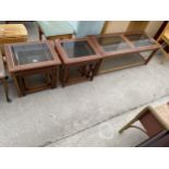 TWO NESTS OF TABLES AND MATCHING COFFEE TABLE, ALL WITH GLASS TOPS