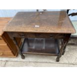 AN OAK JACOBEAN STYLE SIDE TABLE WITH OPEN BASE AND TWO DRAWERS 27" WIDE