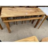 A MODERN HARDWOOD CONSOLE TABLE WITH METALWARE FRIEZE DECORATION ON TURNED LEGS 47" WIDE