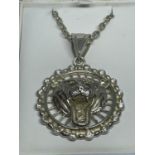 A SILVER LIONS HEAD NECKLACE