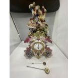 A DECORATIVE FRENCH PORCELAIN MANTLE CLOCK WITH A COURTING COUPLE AND GRAPES DECORATION