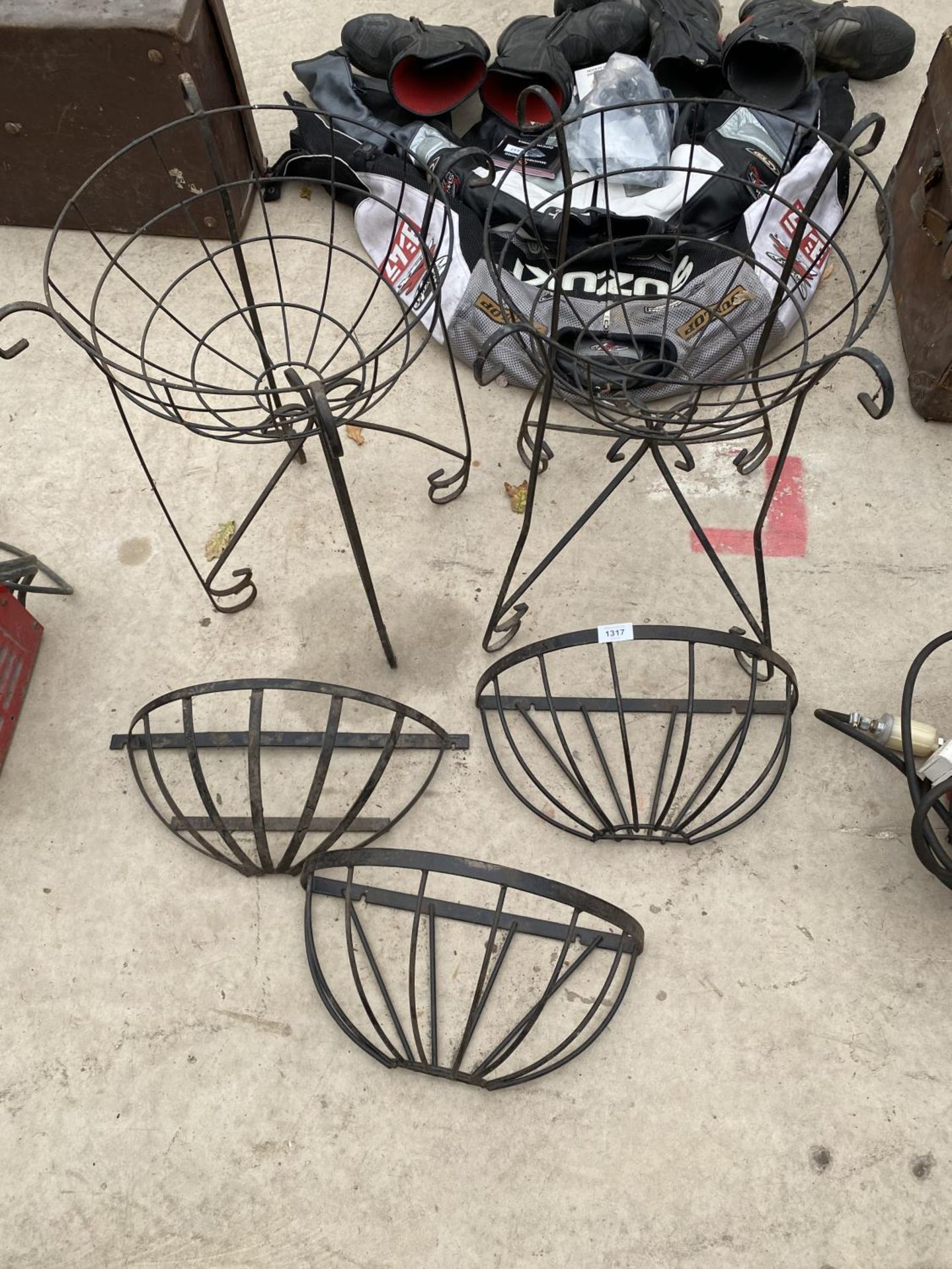 THREE SMALL METAL HAYRACK PLANTERS AND TWO METAL PLANTERS