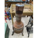 A CAST IRON GARDEN CHIMENEA