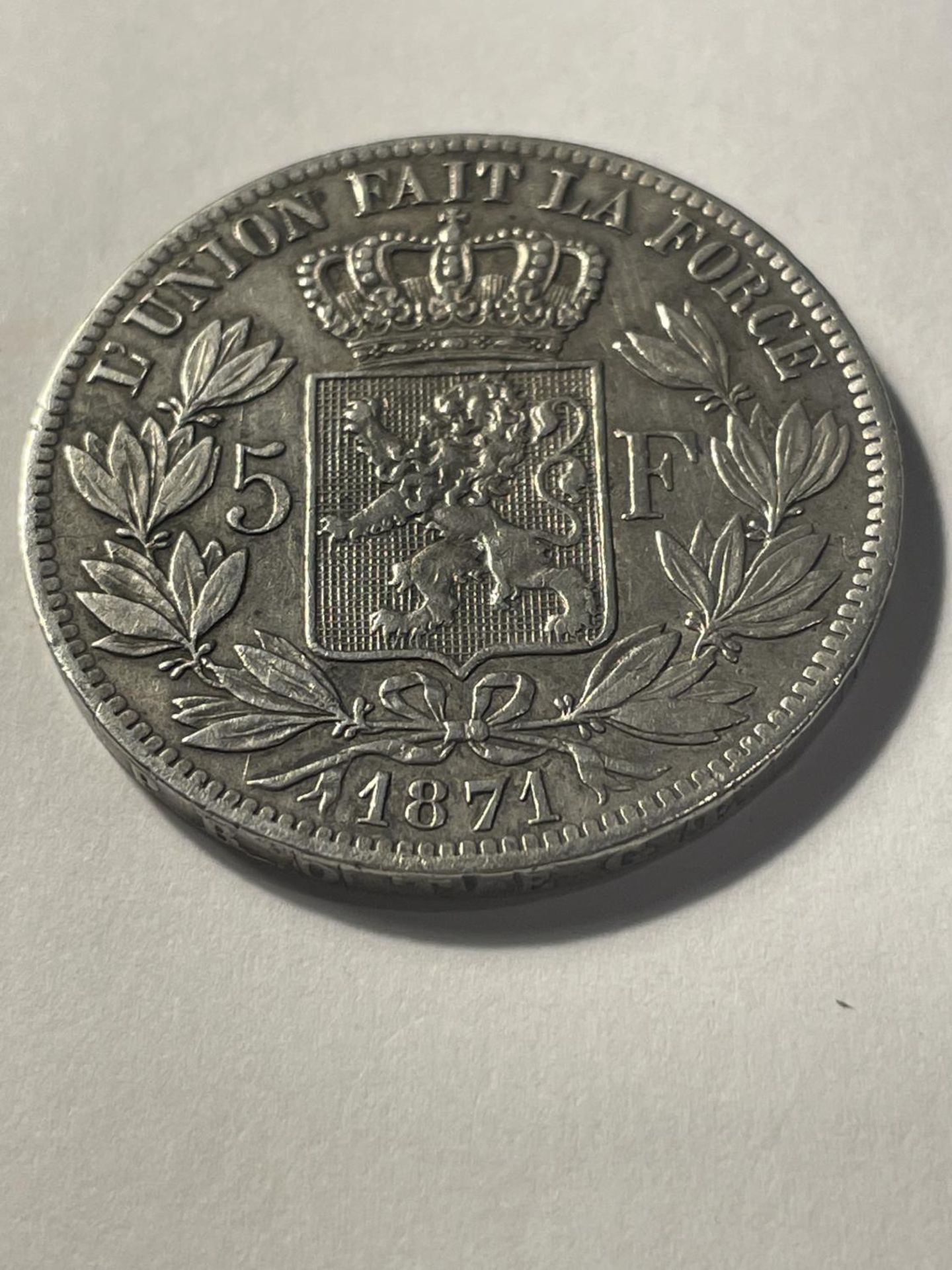A COIN MARKED 1871 LEOPOLD II