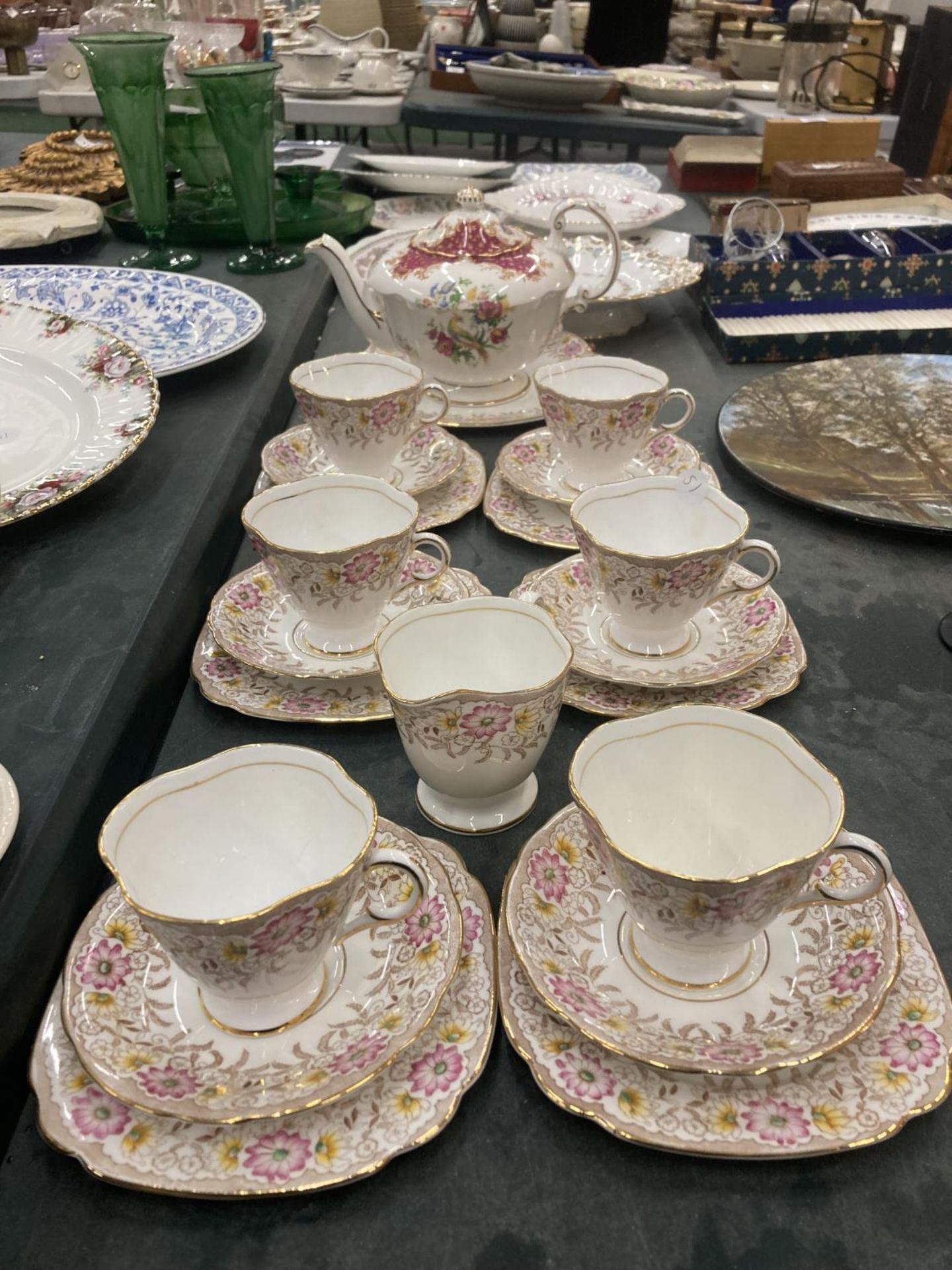 A WINDSOR SET OF SIX TRIOS,CAKE PLATE AND A CREAM JUG IN A FLORAL PATTERN PLUS A PARAGON 'BIRD OF