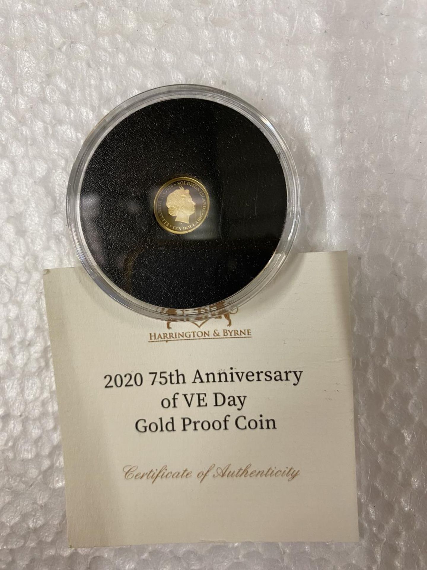 SOLOMON ISLANDS “2020 75TH ANNIVERSARY OF VE DAY” 24 CARAT GOLD PROOF COIN WITH COA . THE COIN - Image 2 of 3