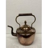 A HEAVY COPPER KETTLE WITH ACORN FINIAL