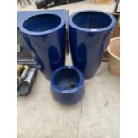 TWO FIBRE GLASS PLANTERS AND A FURTHER LOWER FIBRE GLASS PLANTER (H:59CM AND H:26CM)