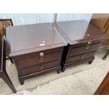 A PAIR OF STAG MINSTREL BEDSIDE CHESTS WITH PULL-OUT SLIDES, WITH GLASS KNOB, 21" WIDE EACH