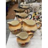 A QUANTITY OF JUGS TO INCLUDE A GRADUATED SET OF THREE ARTHUR WOOD PLUS ANOTHER GRADUATED SET WITH A