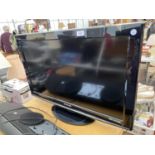 A PANASONIC 32" TELEVISION WITH REMOTE CONTROL