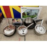SEVERAL STAINLESS STEEL PANS, A TOASTIE MAKER AND A CHOPPING BOARD