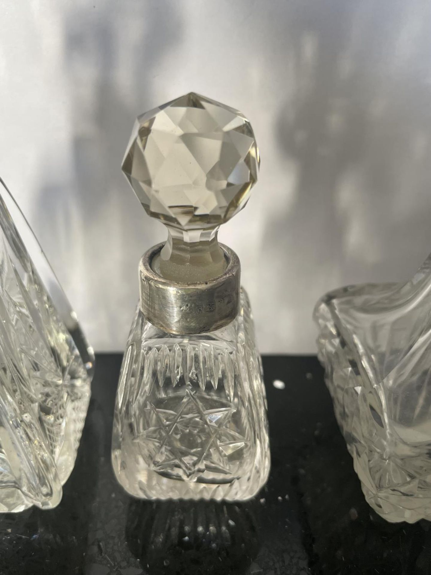 THREE CUT GLASS PERFUME BOTTLE WITH HALLMARKED LONDON SILVER COLLARS - Image 3 of 4