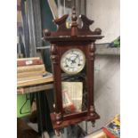 A VINTAGE STYLE 31 DAY WALL CLOCK IN A MAHOGANY AND GLASS CASE WITH PENDULUM AND KEY