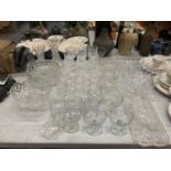 A LARGE QUANTITY OF GLASSWARE TO INCLUDE GLASSES, DISHES ETC