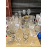 A LARGE ASSORTMENT OF GLASS WARE TO INCLUDE VASES, BRANDY BALLOONS AND WINE GLASSES ETC